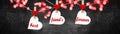 Best friends forever background banner panorama - White hearts hang on wooden clothes pegs hang on a string isolated on black
