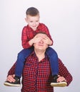 Best friends forever. Father little son red shirts family look outfit. Dad piggybacking adorable child. Happiness being Royalty Free Stock Photo