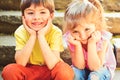 Best friends, friendship and family. childhood first love. small girl and boy on stairs. Relations. summer holiday and Royalty Free Stock Photo