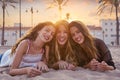 Best friends girls at sunset beach sand Royalty Free Stock Photo