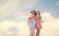 best friends hold bear toy. two sisters with teddy bear. happy childhood. summer vacation. small girls embrace. love and