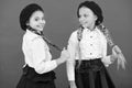 Best friends. Little girls with braids ready for school. School fashion concept. Fancy style. School friendship