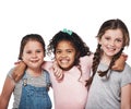 Best friends make you feel your best. Studio portrait of a group of three happy girls embracing one another against a Royalty Free Stock Photo