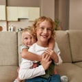Best friends. Portrait of happy siblings, little boy and girl smiling at camera, embracing each other while sitting on a Royalty Free Stock Photo