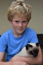 Best friends, schoolboy and his little cat