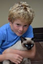 Best friends, schoolboy and his little cat