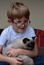 Best friends, schoolboy and his little cat