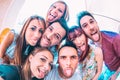 Best friends taking crazy selfie at city tour trip - Happy friendship with millennial students having fun together - Everyday life Royalty Free Stock Photo