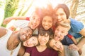 Best friends taking happy selfie outdoor with back lighting