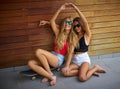 Best friends teen girls on skate having fun Royalty Free Stock Photo