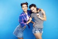 Best friends teenage school girls together having fun, posing emotional on blue background, besties happy smiling