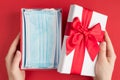 Best gift on Christmas concept. Top above overhead first person view photo of female hands unwrapping present box with stack of