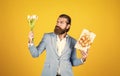 best gift ever. true gentleman with bouquet. love date concept. bearded man in formalwear with tulip flowers and box Royalty Free Stock Photo