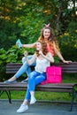 Best girlfriends on bench. Photos in park. Group selfies.