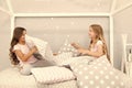 Best girls sleepover party ideas. Girls happy best friends in pajamas with pillows sleepover party. Soulmates girls