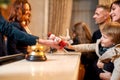 The best holidays start here. Happy family checking in hotel at reception desk. Hotel worker is giving a toy for a boy Royalty Free Stock Photo