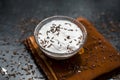 Best home remedy for constipation i.e. Raw yogurt with some cumin or cumin powder in it.All the ingredients on wooden surface. Royalty Free Stock Photo
