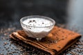 Best home remedy for constipation i.e. Raw yogurt with some cumin or cumin powder in it.All the ingredients on wooden surface. Royalty Free Stock Photo