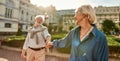 The best husband ever! Beautiful and happy senior couple holding hands and smiling while spending time together outdoors Royalty Free Stock Photo