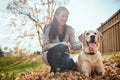 The best kind of friend has fur and four legs. an attractive young woman having fun with her dog on an autumn day in a Royalty Free Stock Photo