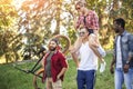 Best multiracial friends hanging out together and walking in park in summer day. Royalty Free Stock Photo