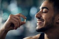 Best Multivitamins. Portrait Of Handsome Young Arab Guy Holding Supplement Capsule