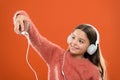 Best music apps for free. Enjoy music concept. Enjoy perfect sound. Girl child listen music modern headphones and