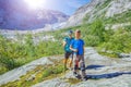 Best Norway hike. Cute boy and his mother with hiking equipment in the mountains