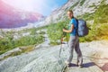 Best Norway hike. Cute girl with hiking equipment in the mountains