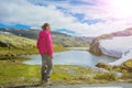 Best Norway hike. Cute girl with hiking equipment in the mountains