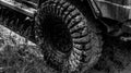 Best Off Road Vehicles. Off-road vehicle goes on the mountain. Bottom view to big offroad car wheel on country road and