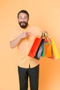 Best outfit ever. brutal caucasian hipster with moustache. Bearded man with shopping bags. Happy holidays. big sale in Royalty Free Stock Photo