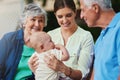 The best parents get promoted to grandparents. a three generational family spending time outdoors.