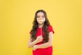 Best party. happy childhood. small kid yellow background. cheerful child with beautiful long hair. little beauty Royalty Free Stock Photo