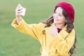 Best phone for taking selfie. Happy little girl make video call on mobile phone. Small child use phone camera for live Royalty Free Stock Photo