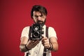 best photographer. handsome hipster making vintage photo. mature journalist use old technology. bearded camera man in