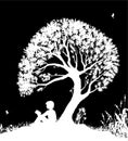 Best place to read concept, boy reading under the big tree, park scene in black and white, childhood memories, shadow