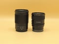 The best portrait lens is Nikon Nikkor Z 85mm F1. 8 S black and the best wide angle lens is Sony FE 20mm F1.8 G black on a yellow