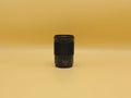 Best portrait lens Nikon Nikkor Z 85mm 1.8 S black on yellow background. Opinion of the European Association