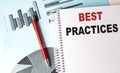 BEST PRACTICES text on notebook on chart background Royalty Free Stock Photo