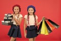 Best price. Buy now. Visit shopping mall. Kids girls hold bunch shopping bags or birthday gifts packages. Dreams come Royalty Free Stock Photo