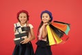 Best price. Visit shopping mall. Kids girls hold bunch shopping bags or birthday gifts packages. Dreams come true. Happy Royalty Free Stock Photo
