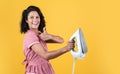 best quality. steaming iron. pinup girl prepare ironing. vintage lady hold modern iron. Everyday life housework. retro Royalty Free Stock Photo