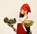 Best salads from chef. Handsome waiter or cook in uniform