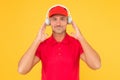 Best sounding headphones. Happy guy wear headphones yellow background. Handsome man listen to music in headphones. Using Royalty Free Stock Photo