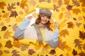 The best style and shape. Fashion girl look through torn paper with autumn leaves. Casual fashion trends for fall Royalty Free Stock Photo