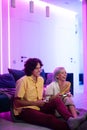 The best team ever. Beautiful lovers on a date indoors, they are playing video games. Their team have won, they are Royalty Free Stock Photo