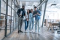 Best team ever. Group of young multi ethnic business people in smart casual wear working together and smiling while standing in Royalty Free Stock Photo