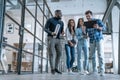 Best team ever. Group of young multi ethnic business people in smart casual wear working together and smiling while standing in Royalty Free Stock Photo