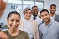 The best team to be a part of. Portrait of a group of businesspeople taking selfies together in an office. Royalty Free Stock Photo